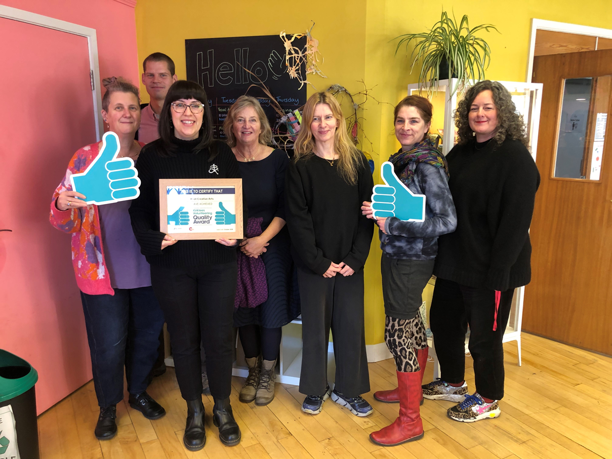 The hoot team are holding the Kirklees Volunteer Quality Award Certificate