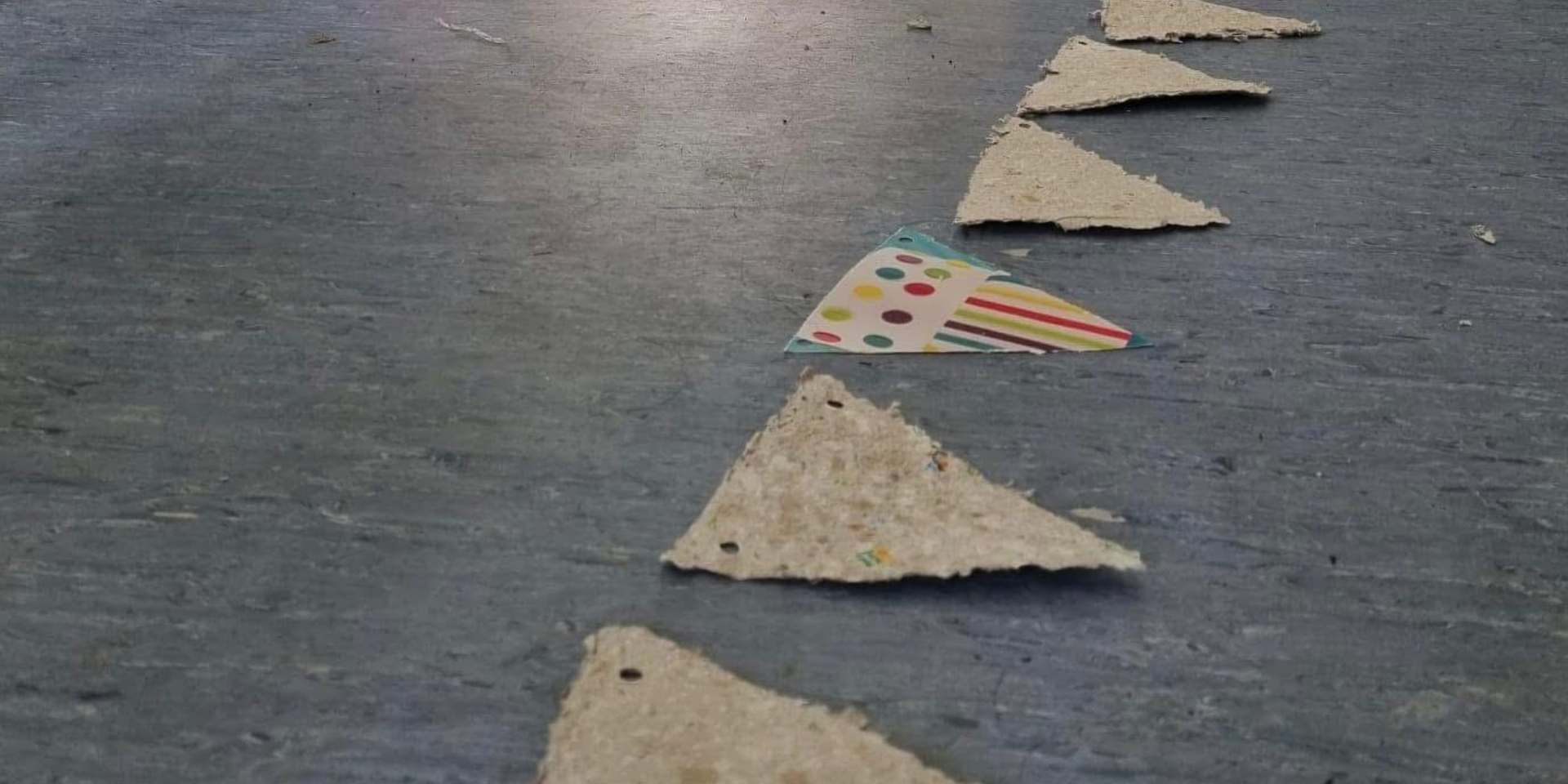 A row of handmade triangle paper bunting