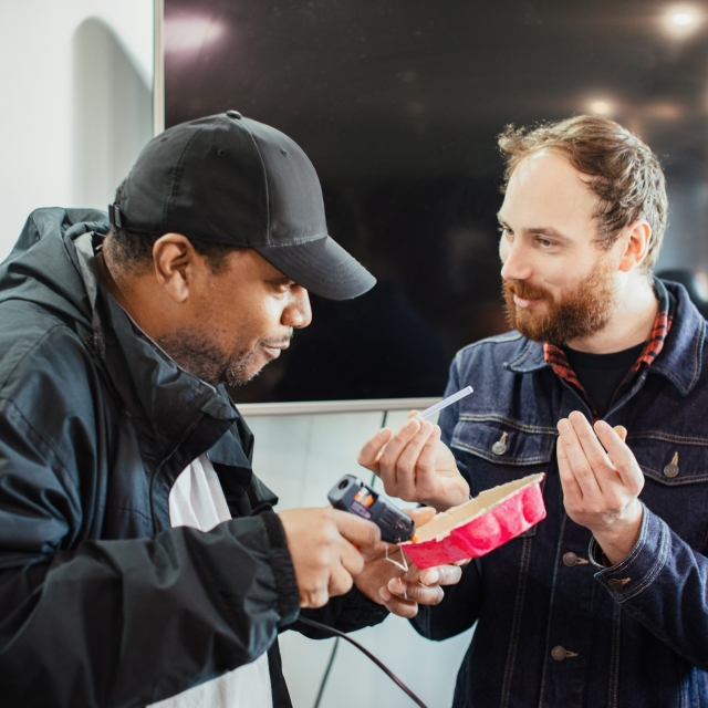 Two men painting 