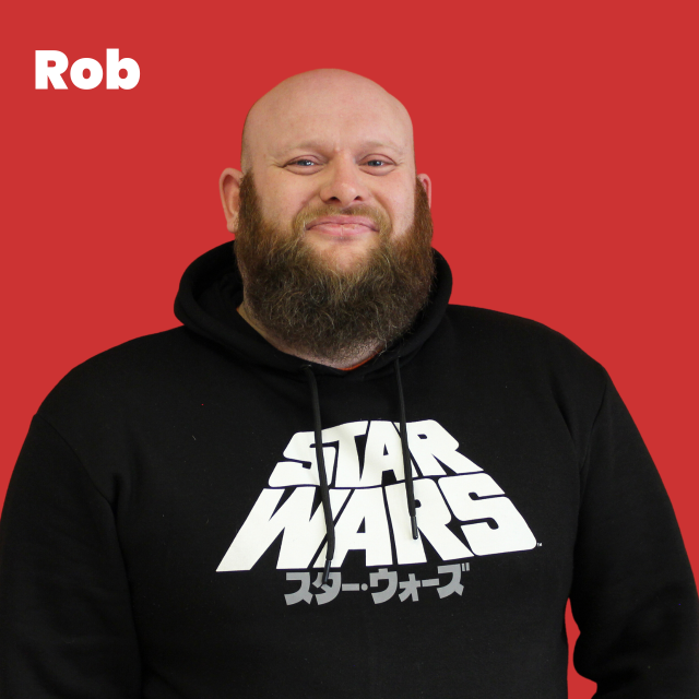 Picture of Rob, white man, no hair, brown beard,  black star wars hoodie